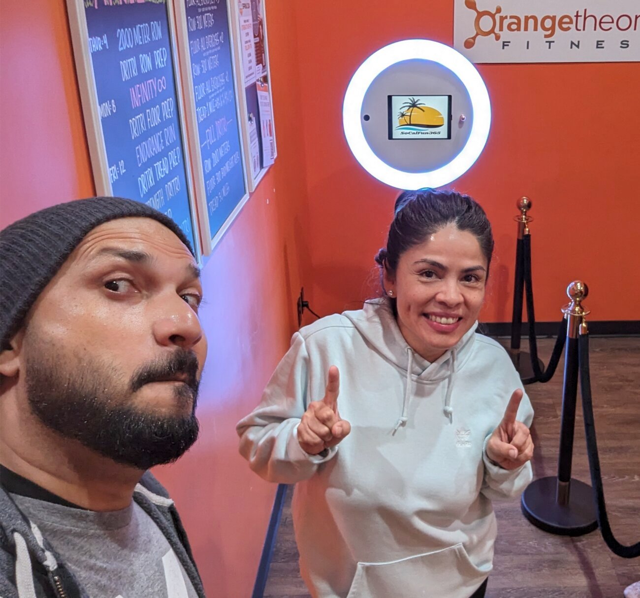 The two owners of SoCalFun365 with their 360 photo booth at an Orange County event