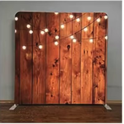 Rustic wood plank photo booth backdrop with hanging string lights
