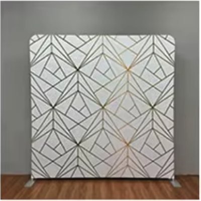 White photo booth backdrop with a gold geometric line pattern