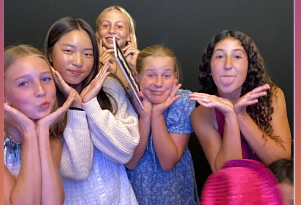 Kids posing playfully in the SoCalFun365 photo booth