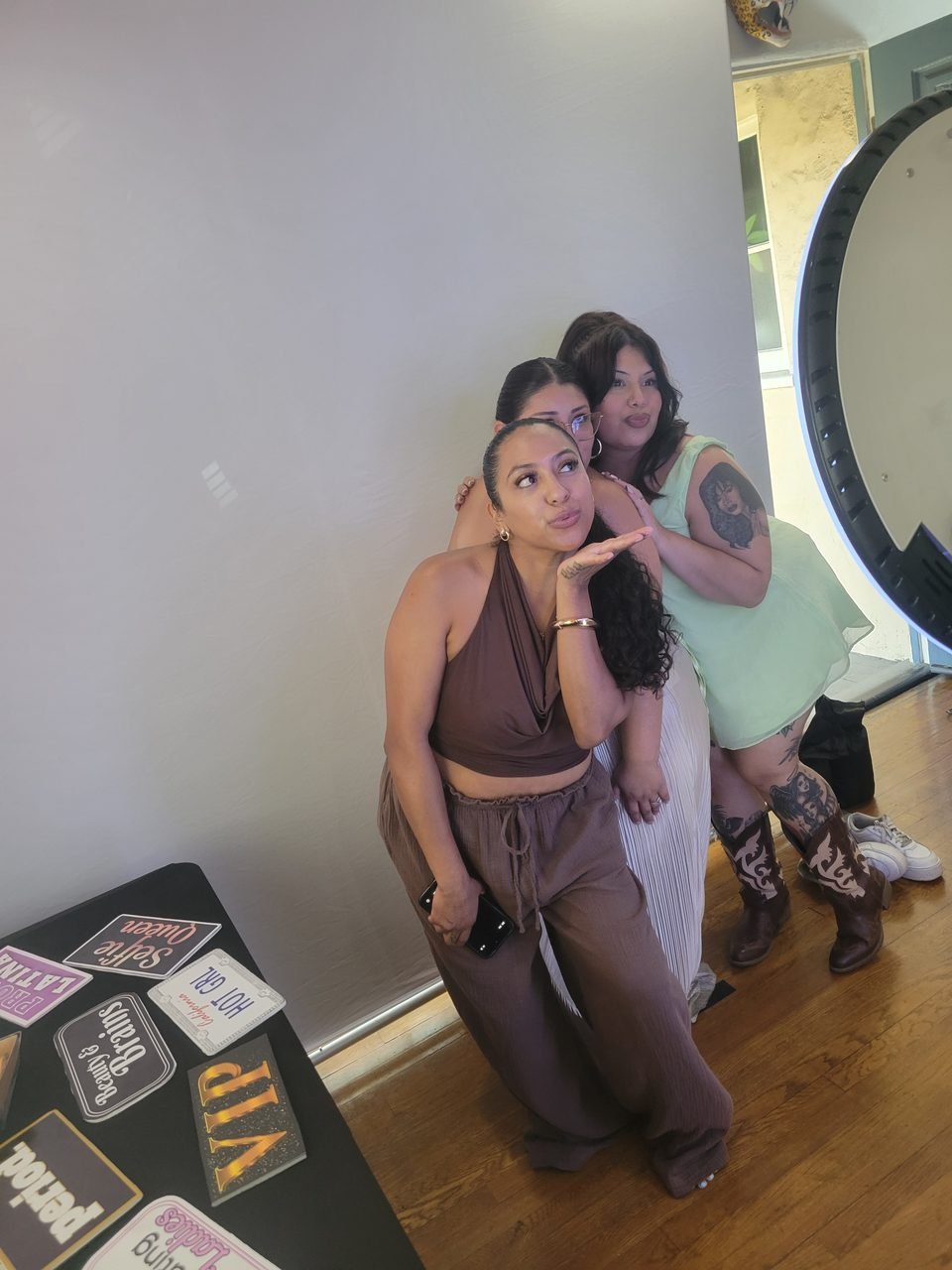 Guests celebrating at the SoCalFun365 open-air photo booth during a women's event in Orange County